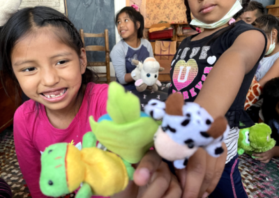 kids playing with puppets at summer camp scec