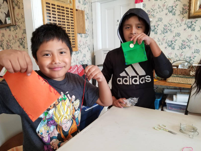 boys sewing los pueblos