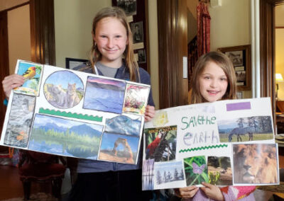 homeschool girls w earth day posters