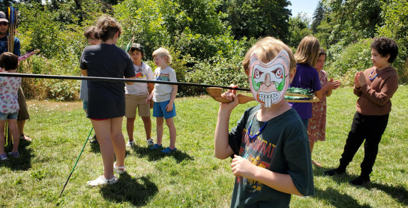 atlatl wearing mask