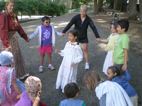 blind child and helper at SCEC program inclusion access