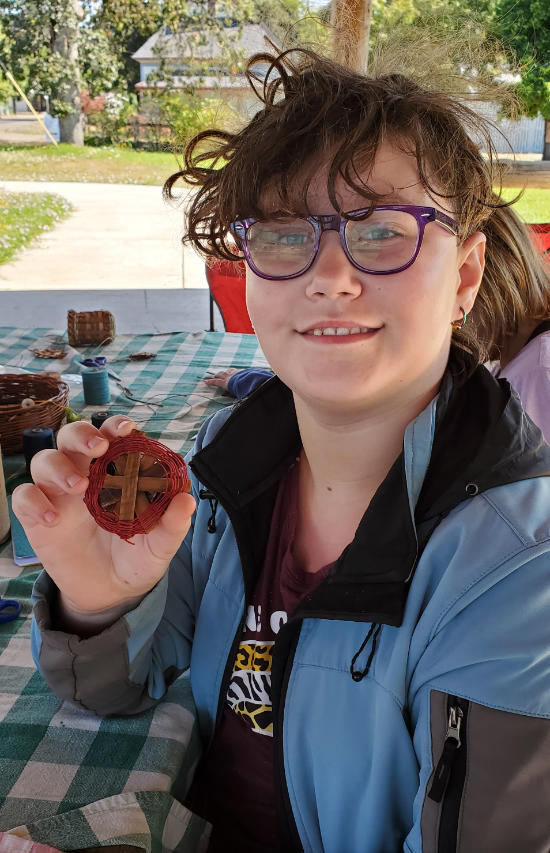 camper with basket necklace