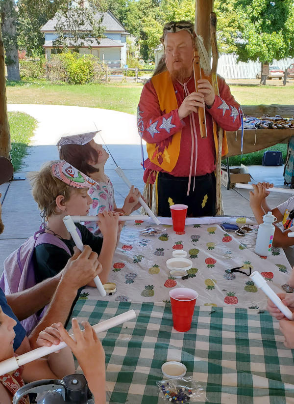 shane red bear with kids flutes