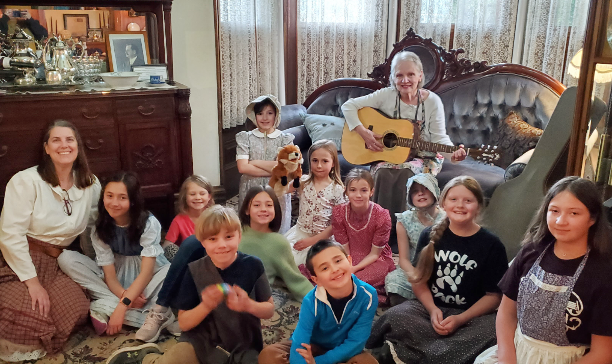 Karen W with guitar at SMJ house with kids